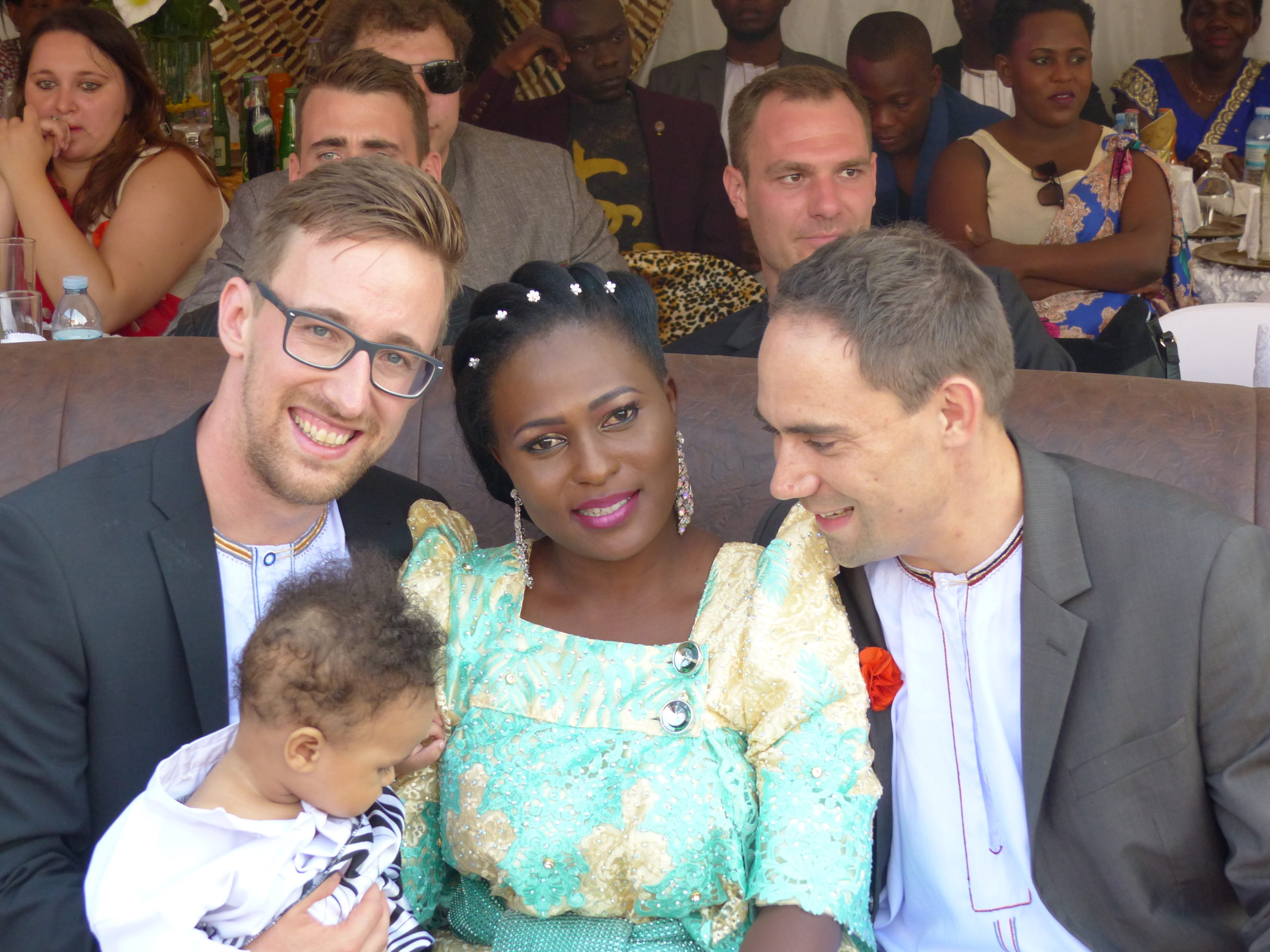 Buganda cultural introduction with Gentlemen putting on Ekanzu and the lady in a Gomesi